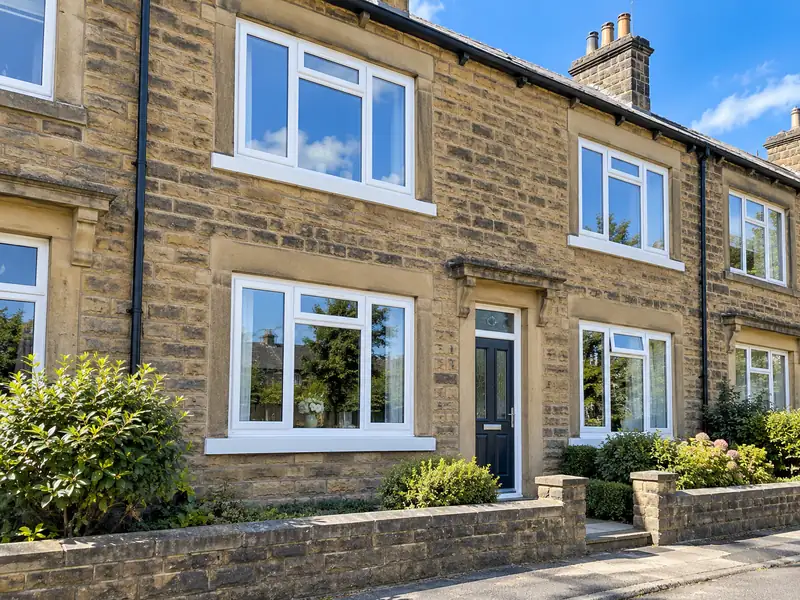 New white uPVC windows fitted on a stone terraced house in Halifax